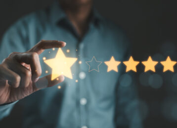 Customer review satisfaction feedback survey concept. User give rating to service excellent experience on mobile phone application, Client evaluate quality of service reputation ranking of business.